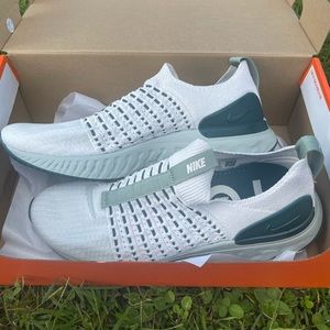 Brand new in original box. Womens Nike React Phantom Run Flyknit 2 running shoe